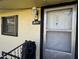 Close-up of an entryway with a security camera, showcasing the address and door details at 107 Creel St, Chapel Hill, NC 27516