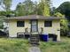 Modest single-story home featuring a simple front yard and classic architectural details at 107 Creel St, Chapel Hill, NC 27516