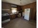 Functional kitchen features a classic stove, sink, and refrigerator with wood cabinets at 107 Creel St, Chapel Hill, NC 27516