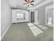 Primary bedroom with trey ceilings, a ceiling fan, and a large mirrored cabinet at 109 Somerset Farm Dr, Holly Springs, NC 27540