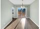 Bright dining area with hardwood floors and sliding glass doors to the backyard at 109 Somerset Farm Dr, Holly Springs, NC 27540