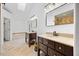 Bright bathroom featuring dual vanities with stone countertops and large mirrors, plus a separate shower at 123 Gettysburg Dr, Cary, NC 27513