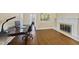 Bright office with hardwood floors and a fireplace, perfect for working from home at 1401 Granada Dr, Raleigh, NC 27612