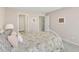 Bedroom with neutral walls, white trim, and an inviting floral bedspread at 1753 Kingston Heath Way, Raleigh, NC 27604