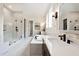 Charming bathroom with double vanity, soaking tub, stand alone shower and unique patterned wall coverings at 1964 Old Byre Way, Apex, NC 27502