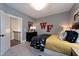 This cozy bedroom featuring a full-size bed, bedside tables, and gray accent walls provides an inviting ambiance at 1964 Old Byre Way, Apex, NC 27502
