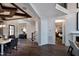 Open foyer featuring wood floors, shiplap wall, and entry to bedroom at 1964 Old Byre Way, Apex, NC 27502