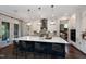 Spacious kitchen features a large island with seating and modern pendant lighting at 1964 Old Byre Way, Apex, NC 27502