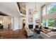 Bright, airy living room boasts high ceilings, fireplace, and large windows for abundant natural light at 1964 Old Byre Way, Apex, NC 27502