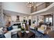 Bright living room with fireplace that flows to kitchen and dining areas at 1964 Old Byre Way, Apex, NC 27502