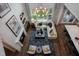 Bright living room with a fireplace, chandelier, large sectional, and big windows for natural light at 1964 Old Byre Way, Apex, NC 27502