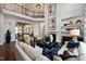 Spacious living room with fireplace, hardwood floors, and a view of dining room at 1964 Old Byre Way, Apex, NC 27502