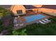 Overhead view of a pool with lounge chairs, fire pit, and a manicured backyard at 214 Reynolds Rd, Raleigh, NC 27609