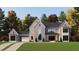 Charming two-story home with cedar shake siding, a shingle roof, and a well-manicured lawn at 214 Reynolds Rd, Raleigh, NC 27609
