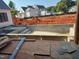 New home construction featuring an in-ground pool surrounded by red clay at 214 Reynolds Rd, Raleigh, NC 27609