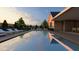 A stunning pool view features clear water, deck chairs, and a serene lounge space at 214 Reynolds Rd, Raleigh, NC 27609