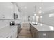 Contemporary kitchen showcasing white countertops and stainless steel appliances at 264 White Oak Garden Way # 207, Garner, NC 27529