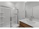 Modern bathroom features a glass shower door, white tile, and sleek hardware, offering a clean, contemporary design at 272 White Oak Garden Way # 209, Garner, NC 27529