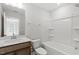 Bright bathroom featuring a shower-tub combo, modern vanity, and neutral finishes at 272 White Oak Garden Way # 209, Garner, NC 27529