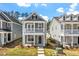 Charming two-story home with a welcoming front porch and balcony, complemented by beautifully maintained landscaping at 272 White Oak Garden Way # 209, Garner, NC 27529