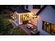 Picturesque backyard with patio seating, string lights, and well-maintained landscaping at 299 Seaforth Landing Dr, Pittsboro, NC 27312
