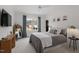 Bright bedroom features a neutral color palette, modern fixtures, and ample natural light at 299 Seaforth Landing Dr, Pittsboro, NC 27312