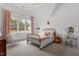 Charming bedroom featuring a sloped ceiling, a bed with pink accents, and an airy feel at 299 Seaforth Landing Dr, Pittsboro, NC 27312