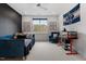 Comfortable bedroom includes a daybed, arm chair, and an aquarium with ample natural light at 299 Seaforth Landing Dr, Pittsboro, NC 27312