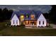 Stunning two-story home with a manicured lawn and inviting front porch seating at 299 Seaforth Landing Dr, Pittsboro, NC 27312