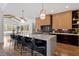 Stylish kitchen featuring a large island with seating and modern lighting at 299 Seaforth Landing Dr, Pittsboro, NC 27312