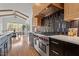 Modern kitchen featuring high-end stainless steel appliances and an expansive island at 299 Seaforth Landing Dr, Pittsboro, NC 27312