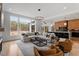 Spacious living area open to the kitchen, with hardwood floors and large windows at 299 Seaforth Landing Dr, Pittsboro, NC 27312