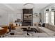 Bright living room features contemporary decor, fireplace, and hardwood floors at 299 Seaforth Landing Dr, Pittsboro, NC 27312