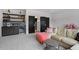 Modern living room featuring a built-in wine bar, mini fridge and floating shelves at 299 Seaforth Landing Dr, Pittsboro, NC 27312