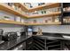 A well-organized pantry with open shelving, black countertops and custom wine storage at 299 Seaforth Landing Dr, Pittsboro, NC 27312