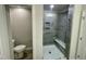 Bathroom featuring a walk-in shower with tile surround and a separate toilet room at 3024 Freewinds Way # 49, Cary, NC 27519