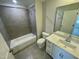 A full bathroom features a shower-tub combo and a vanity with a sink at 3024 Freewinds Way # 49, Cary, NC 27519