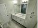 Bathroom with a double sink vanity, large mirror, modern fixtures, and walk-in shower at 3024 Freewinds Way # 49, Cary, NC 27519
