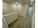 Upstairs hallway with carpeted floors and white trim and doors at 3024 Freewinds Way # 49, Cary, NC 27519