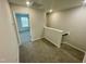 Upstairs hallway with carpeted floors and white trim and doors at 3024 Freewinds Way # 49, Cary, NC 27519