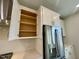 Modern kitchen with lots of storage in bright white cabinets and stainless steel refrigerator at 3024 Freewinds Way # 49, Cary, NC 27519