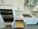 Kitchen features pull-out shelves for easy access to appliances and utensils at 3024 Freewinds Way # 49, Cary, NC 27519