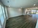Bright and spacious living room showcasing luxury wood flooring and open concept to the kitchen at 3024 Freewinds Way # 49, Cary, NC 27519