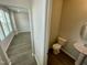 The powder room has a white toilet and sink at 3024 Freewinds Way # 49, Cary, NC 27519