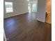 Spacious living room with hardwood floors and natural light at 322 Oak Branch Trl, Garner, NC 27529