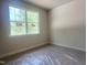 Bright bedroom with large window offering natural light, freshly painted neutral walls, and protected carpet at 362 Barbour Farm Ln, Four Oaks, NC 27524