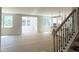 Expansive living space with abundant natural light, seamlessly connecting the kitchen and dining areas at 362 Barbour Farm Ln, Four Oaks, NC 27524