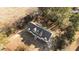 Aerial view of house showing yard, roof, front porch, and mature trees at 406 Stewart Town Rd, Lillington, NC 27546