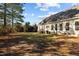 Spacious backyard with a clear view of the home's exterior and various windows at 406 Stewart Town Rd, Lillington, NC 27546