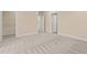 Neutral bedroom featuring soft carpet and two doorways for closets or private ensuite bathroom at 406 Stewart Town Rd, Lillington, NC 27546